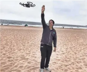  ??  ?? Jefferson Graham commands the DJI Spark drone with his hands. The motionacti­vated device could be the wave of the future. RUTH STROUD