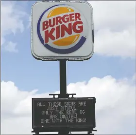  ??  ?? Burger King takes a sign war shot with their digital display sign.