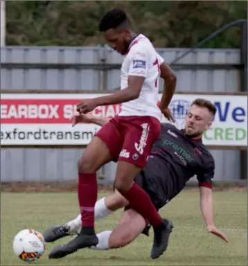  ??  ?? Aaron O’Connor of Wexford slides in to challenge Galway United’s Carlton Ubaezuonu.