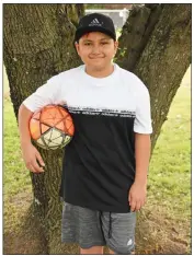  ?? STACI VANDAGRIFF/THREE RIVERS EDITION ?? Jace Ruiz stands outside with his soccer ball. He said soccer is one of his favorite activities on his YouTube page.