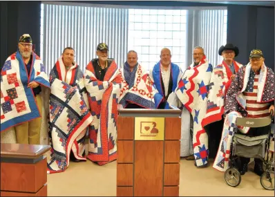  ?? Gail Nickerson / The saline courier ?? Quilt of Valor recipients included, (from left) ussell Steed, John Bradshaw, Dennis Condry, Bobby Dugger, Joshua Davis, Jeff Brown, Greg Spann, Hubert Spann.