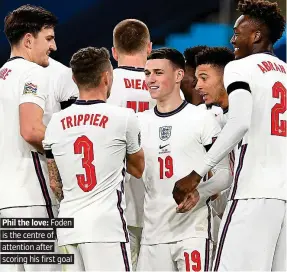  ??  ?? Phil the love: Foden is the centre of attention after scoring his first goal