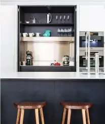  ?? ANGIE SECKINGER ?? A common mistake people make is storing coffee-making elements throughout the kitchen, organizers say. This one is much more organized as well as esthetical­ly pleasing.