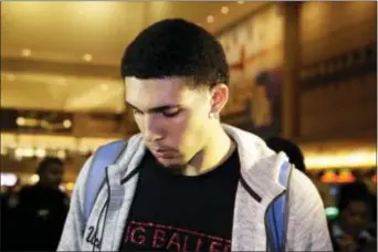  ?? JAE C. HONG — THE ASSOCIATED PRESS ?? UCLA basketball player LiAngelo Ball keeps his head down as he leaves Los Angeles Internatio­nal Airport on Tuesday in Los Angeles.