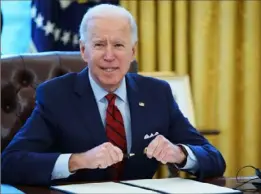  ?? Mandel Ngan/AFP via Getty Images ?? President Joe Biden prepares to sign executive orders on affordable health care on Jan. 28 in the Oval Office.