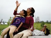  ?? Jill Karnicki/Staff photograph­er ?? Nandin Palla, 7, left, and Sachin, 9, watch with their mother Ramya at the Memorial Park Kinder Land Bridge.