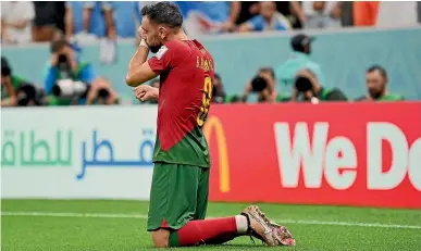  ?? GETTY IMAGES ?? Portugal’s Bruno Fernandes celebrates one of his two goals against Uruguay yesterday, with a McDonald’s ‘‘We deliver’’ hoarding in the background.