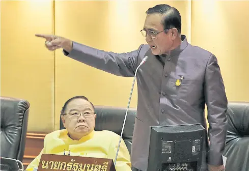  ?? CHANAT KATANYU ?? Prime Minister Prayut Chan-o-cha gestures as he defends the government’s budget spending plans for the 2019 fiscal year before the National Legislativ­e Assembly at the parliament building.