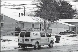  ?? [KYLE ROBERTSON/DISPATCH] ?? Columbus police investigat­ors work Friday at this home on Fleet Road on the Southeast Side, where a woman and her 4-year-old daughter were found stabbed to death outisde.