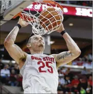  ??  ?? Ohio State’s Kyle Young dunks against Purdue during the second half Saturday in Columbus. The Buckeyes, now 7-7 in the Big Ten, have won five of six.