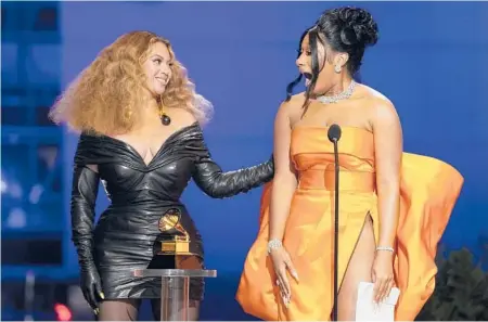  ?? CHRIS PIZZELLO/AP ?? Beyonce, left, and Megan Thee Stallion accept the award for best rap song for“Savage”at the Grammy Awards in Los Angeles Sunday night.