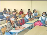  ?? HT PHOTO ?? Students of HL Madhyamik Vidya Bhavan in Borivali attend class wearing masks.