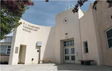  ?? PHOTOS BY CLYDE MUELLER/THE NEW MEXICAN ?? Santa Fe Public Schools is considerin­g closing E.J. Martinez Elementary School on West San Mateo Road to help close a possible $9.45 million budget deficit. Students now in the E.J. Martinez district would be zoned to attend either Acequia Madre,...