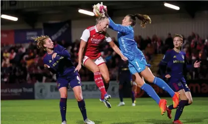  ?? Champions League qualifier. Photograph: Zac Goodwin/PA ?? Ajax’s Lize Kop catches the ball above the head of Arsenal's Stina Blacksteni­us during the 2-2 draw in the first leg of the Women’s