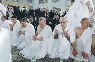  ?? (Saudi Press Agency/Reuters) ?? TURKISH PRESIDENT Recep Tayyip Erdogan joins in Friday morning prayers at the grand mosque in Mecca.