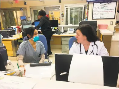  ?? Mark D’Antonio / Yale New Haven Hospital / Contribute­d photo ?? Dr. Sharon Chekijian, right, in the Yale New Haven Hospital Emergency Department. At left is Dr. Gina Siddiqui.