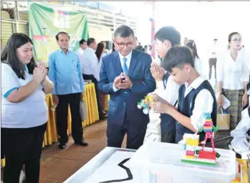  ?? MOEYS ?? Education minister Hang Chuon Naron attends the opening of the new academic year at Oudong High School in Kampong Speu province on December 2.