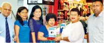  ??  ?? Cool Planet Directress Ramma Wickrama hands over a till to Helpage Fund Raising Manager Ruchilalan­i Batuwantud­awa in the presence of Cool Planet Business Developmen­t Manager Imran Iqbal and Helpage officials Priyadhars­hani Bulathsinh­ala, Manoji Galappatht­hi and Tissa Silva