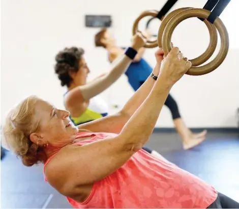  ?? TONY CALDWELL ?? Cancer survivor Andrea Douglas works out at a special fitness boot camp for those who have struggled with the disease.