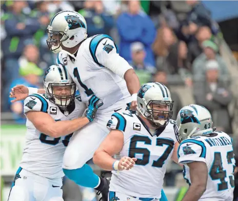  ?? TROY WAYRYNEN, USA TODAY SPORTS ?? Panthers teammates Cam Newton (1) and Greg Olsen (88) celebrate their touchdown that sunk the Seahawks on Sunday.