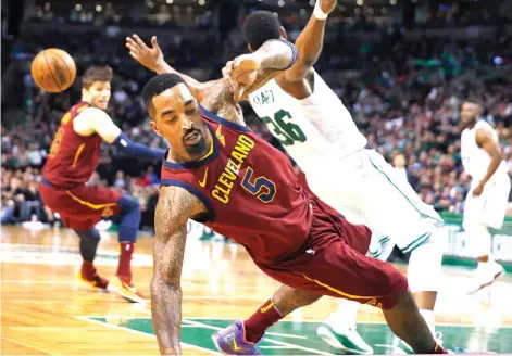  ?? Associated Press ?? ■ Cleveland Cavaliers guard JR Smith (5) and Boston Celtics guard Marcus Smart (36) get entangled during the second quarter of Game 1 of the NBA Eastern Conference Finals Sunday in Boston.