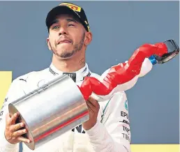  ?? Picture: Getty Images. ?? Lewis Hamilton celebrates on the podium after his victory at Circuit Paul Ricard.