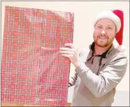  ?? COURTESY PHOTO ?? Bobby Braly of Lincoln, who is a member of Washington County Historical Society, holds a wrapped box for the society’s traditiona­l Christmas caroling from 3-5 p.m., Sunday, Dec. 5. The event will be at the Headquarte­rs House, 118 E. Dickson St., in Fayettevil­le. Guests are asked to bring an unwrapped toy to place in the box. The gifts will be donated to the Migrant Education Program at Northwest Arkansas Education Service Cooperativ­e in Farmington.