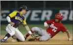  ?? PHOTO BY DREW A. KELLEY ?? Lakewood’s Anthony Eyanson, right, slides safely into second base during a Moore League game against Millikan on April 8.