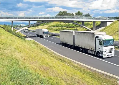  ??  ?? Around 85% of everything you have around you spent time on the back of a lorry. Top: A familiar scene as a fleet of lorries pound the highways. Right: loading up before the next journey. Left: Traffic jams can cause problems for tightly scheduled...