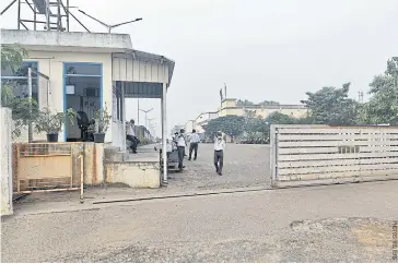  ?? ?? Private security guards stand at the entrance of a Foxconn India plant that makes iPhones for Apple, near Chennai.