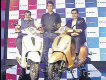  ?? RAMESH PATHANIA/MINT ?? (From left) Union minister Nitin Gadkari, Bajaj Auto MD Rajiv Bajaj and NITI Aayog CEO Amitabh Kant at the launch of electric scooter Chetak in New Delhi.