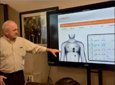  ?? — PNNL photo ?? Senior Project Manager Grant Tietje explains to first responders the placement of VitalTag sensors on patients.