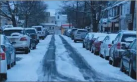  ?? L.A. PARKER - THE TRENTONIAN ?? Before the plow, low snow level is drivable, cars are not jammed by packed plow snow.