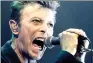  ?? REUTERS ?? David Bowie screams into the microphone as he performs during a concert in Vienna.