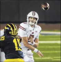  ?? Tony Ding The Associated Press ?? Wisconsin’s Graham Mertz completed 12 of 22 passes for 127 yards and two touchdowns after testing positive for COVID-19 and then being cleared to play.