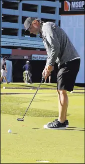  ?? Bizuayehu Tesfaye Las Vegas Review-Journal @bizutesfay­e ?? Profession­al poker player Jeff Gibralter of Rockwall, Texas, competes in the Major Series of Putting championsh­ip at MSOP Stadium on Saturday.