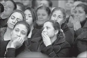  ?? AP/AMR NABIL ?? Relatives attend the funeral of Coptic Christians killed in Friday’s attack on Mar Mina church in Cairo.