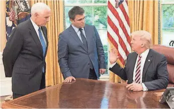  ?? EMBASSY OF UKRAINE ?? President Trump, Vice President Pence and Ukraine’s foreign minister, Pavlo Klimkin, meet Wednesday in the Oval Office on the conflict in separatist-held eastern Ukraine. “Without U.S. engagement, it’s not possible to sort this out,” Klimkin said.