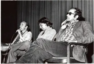  ?? BAMPFA/HNP ?? Tom Luddy interviews French filmmakers Jean-Pierre Gorin and Jean-Luc Godard onstage during the Pacific Film Archive's Godard retrospect­ive that Luddy organized in 1968.