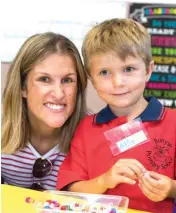  ??  ?? Alfie enjoys some activities with his mum Kate Jones during his first day of prep at Bunyip Primary School.
