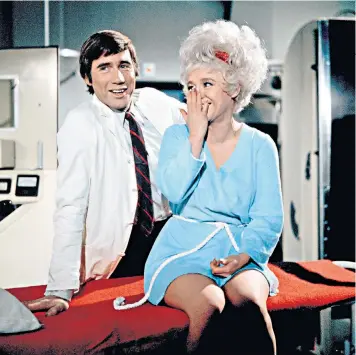  ??  ?? Jim Dale and Barbara Windsor in Carry on Again Doctor. Below, Kenneth Williams (with Albert Moses) in Carry on Emmannuell­e; far right, Hattie Jacques and Kenneth Connor in Carry on Sergeant