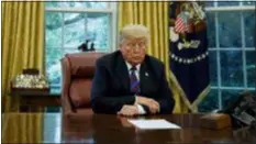  ?? EVAN VUCCI — THE ASSOCIATED PRESS ?? President Donald Trump listens during a phone call with Mexican President Enrique Pena Nieto about a trade agreement between the United States and Mexico, in the Oval Office of the White House, Monday in Washington.