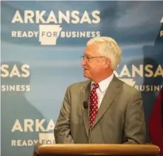  ??  ?? Dr. Joe Thompson, President of the Arkansas Center for Health Improvemen­t, thanks Dr. Nate Smith for his service as Arkansas Secretary of Health, before addressing the media during a press conference on the state’s response to COVID-19 on Friday, July 17. (Arkansas Democrat-Gazette / Stephen Swofford)