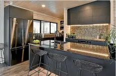  ?? ?? Designed for a new Lockwood home on the Kāpiti Coast, this kitchen features cabinetry built by Ross Craft.