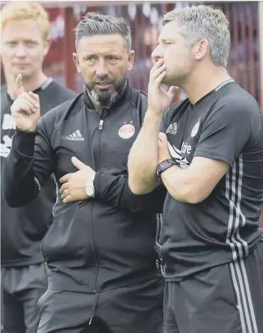  ??  ?? 0 Derek Mcinnes and Tony Docherty’s long term partnershi­p will continue for another two years.