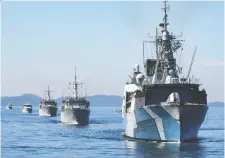  ?? CPL. JAY NAPLES/DND FILES ?? Frigate HMCS Regina followed by HMCS Brandon and HMCS Nanaimo and patrol craft training vessels Cougar and Wolf sail in formation in the Strait of Georgia in April.