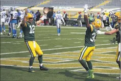  ?? MATT LUDTKE — THE ASSOCIATED PRESS ?? The Green
Bay Packers’ Aaron
Jones, right, celebrates his touchdown run with Chico native Aaron Rodgers
(12) during the second half Sunday against the Detroit Lions in Green Bay, Wis.