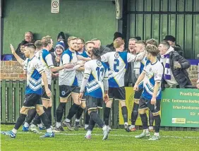  ?? ?? Haywards Heath Town celebrate Ben Connolly’s goal | Picture: Ray Turner