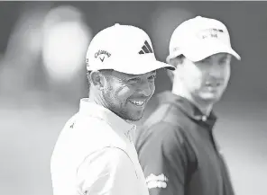  ?? CLIFF HAWKINS/ GETTY IMAGES ?? Xander Schauffele and Patrick Cantlay take in the surroundin­gs during practice before The Players Championsh­ip.