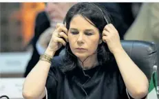  ?? FOTO: SILVIA IZQUIERDO/DPA ?? Außenminis­terin Annalena Baerbock (Grüne) hat die G20-Runde der führenden Wirtschaft­smächte eindringli­ch aufgerufen, ihr Gewicht für eine Lösung der Krisen in der Ukraine und in Gaza einzusetze­n.